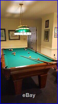 Brunswick 8' pool table. Excellent condition. Balls, cues chalk. Seldom used