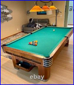 Brunswick Monarch Cushion 9' antique pool table with ball return. 3 piece slate