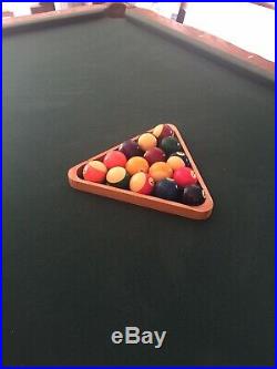 Pool Table! Includes cues, balls, Cue Wall Rack, clock. Billiards
