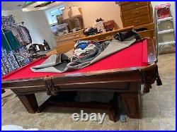 Pool Table, hanging light, cover, pool sticks, and hanging stand for sticks