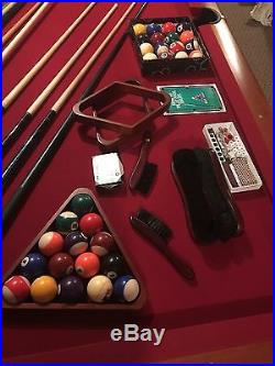 Pool table with auto return, cues, balls, rack and wall rack everything as shown
