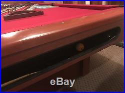 Pool table with auto return, cues, balls, rack and wall rack everything as shown