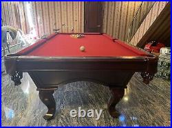 Pool table with cue rack
