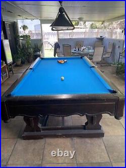 Vintage Brunswick pool table. Good condition some signs of age and use