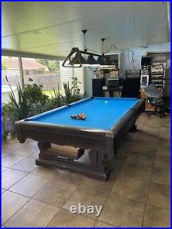 Vintage Brunswick pool table. Good condition some signs of age and use